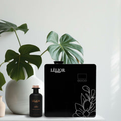 HVAC scenting machine and fragrance on table with plant vase | HVAC Scenting | Lèlior