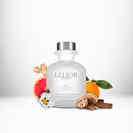 BLEU Fragrance Oil displayed with surrounding fragrance notes, featuring a 50mL clear front glass bottle that highlights the rich, aromatic blend.