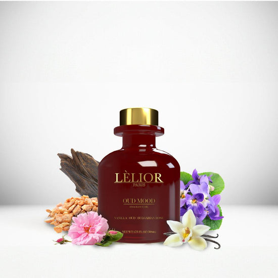 OUD MOOD Fragrance Oil displayed with surrounding fragrance notes, featuring a 50mL burgundy glass bottle that highlights the rich, aromatic blend.